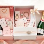 Elegant bridesmaid gift boxes arranged with personalized items and floral accents